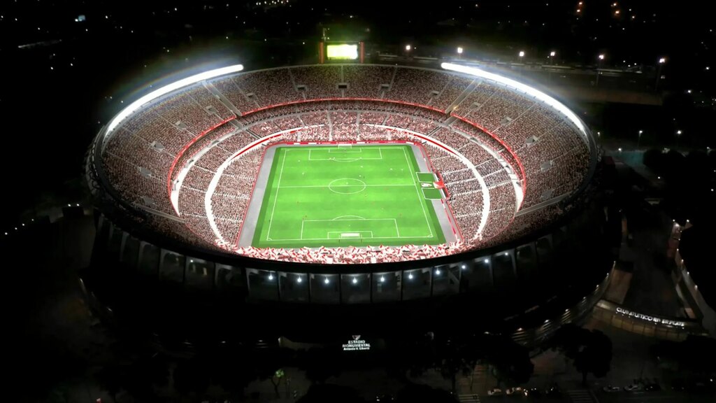 Imagem do estádio monumental à noite e ligado, prestes a receber uma partida