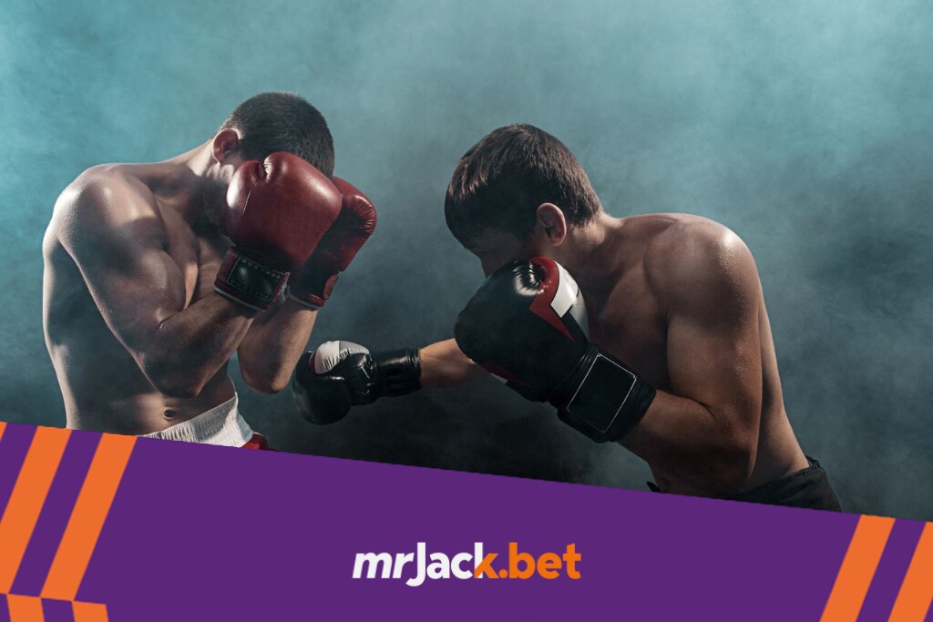 Dois lutadores de boxe trocando. O lutador de luva vermelha defende enquanto o de azul ataca.