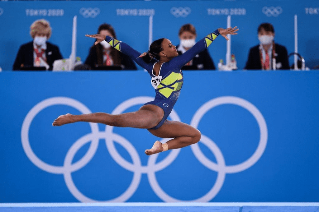 Imagem de atleta feminina em ginástica, competindo nas Olimpíadas